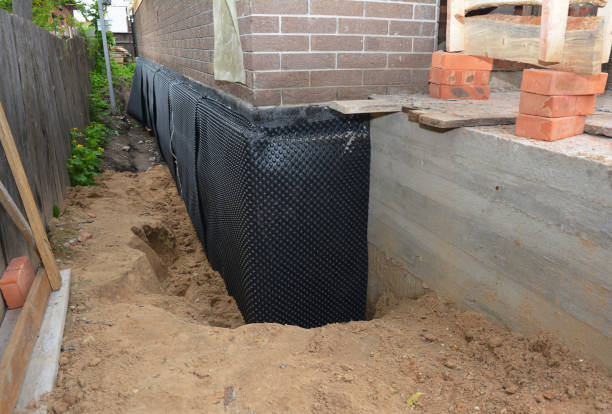 Happy homeowners after waterproofing job in Pennsville